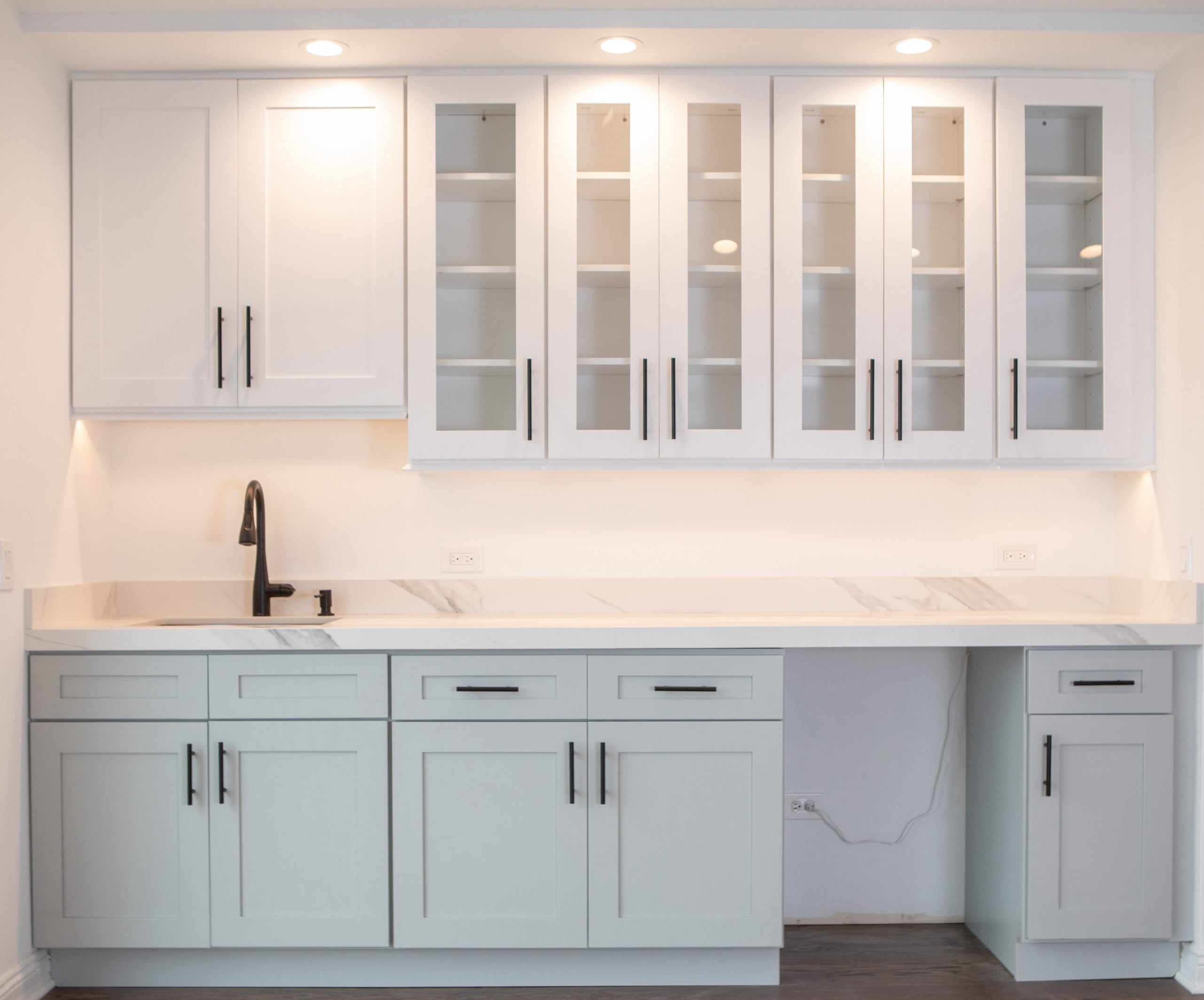 White Shaker Style KCC Cabinets in Showroom